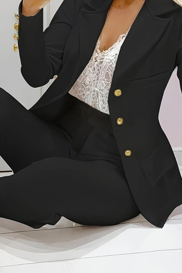 Fashionable women's two-piece suit, elegant blazer & pants. Great for office or stylish events.