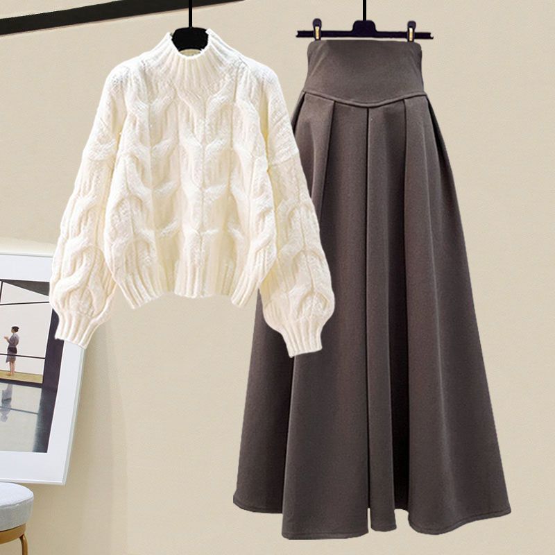 Chic women's sweater and pleated skirt set. Fashionable two-piece outfit perfect for fall elegance.