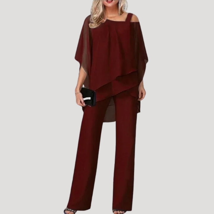 Formal women's trouser suit: chic asymmetric top & flowing wide-leg pants. Perfect for evening wear & parties.