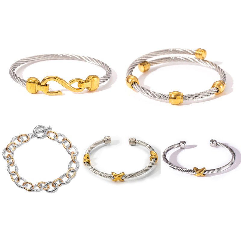 Hand modeling a women's two-tone knot twisted bangle bracelet, showcasing its fit.