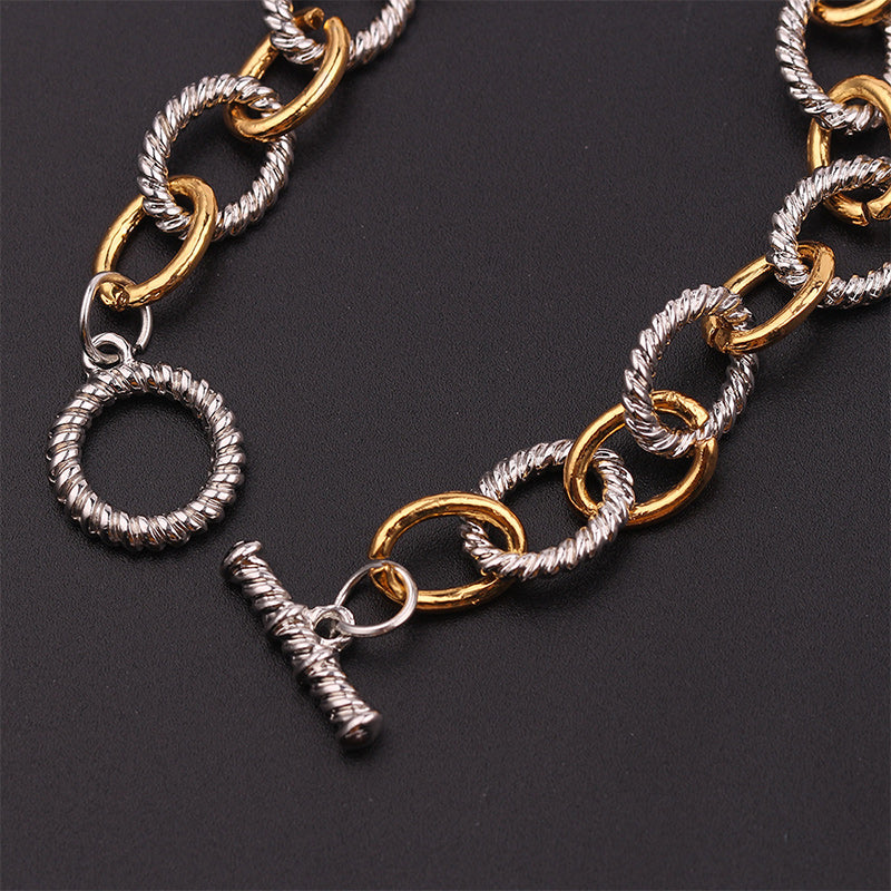 Versatile two-tone knot bangle bracelet, perfect for women's everyday wear or special occasions.