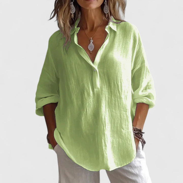 Comfortable women's elegant V-neck blouse in a versatile fabric, ideal for everyday wear, office or summer fashion.