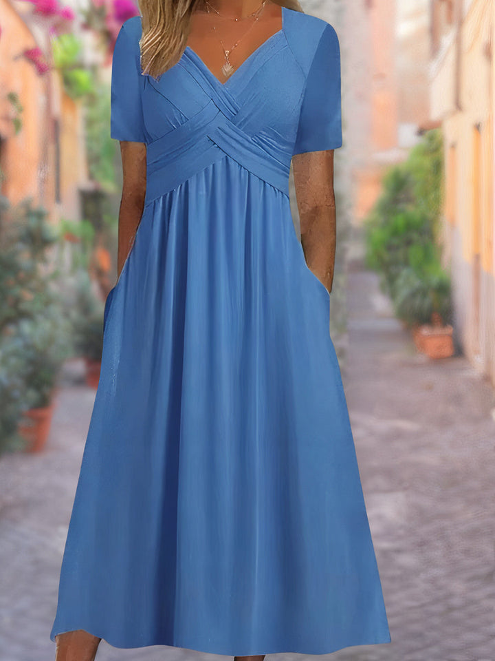 Chic women's V-neck midi dress with an intricate crisscross bodice, designed for comfort and elegance.