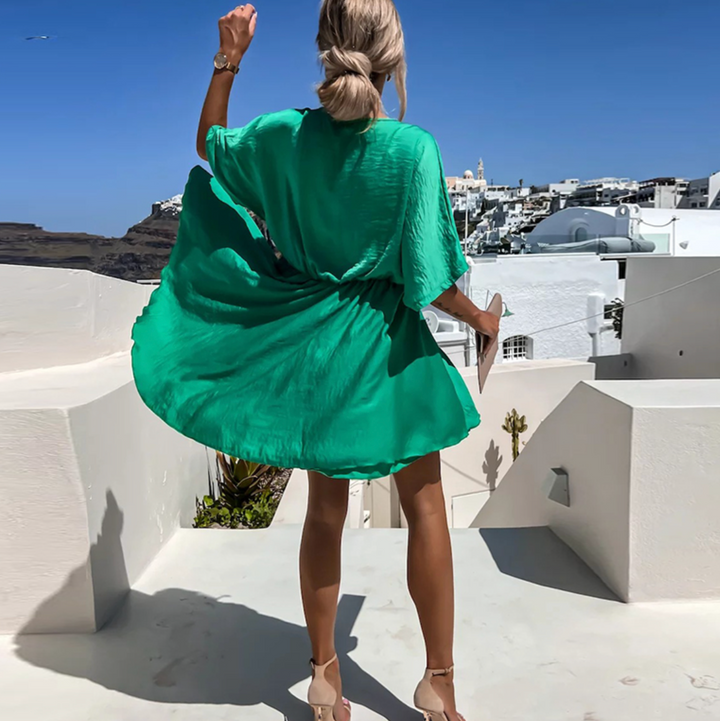 Versatile women's V-neck flowy wrap mini dress. Elegant and comfortable for summer, parties, or vacation.