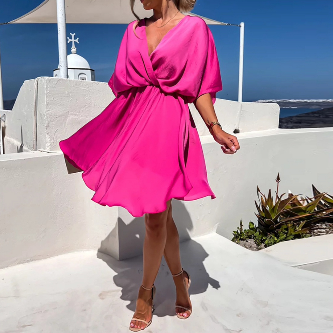 Lightweight women's elegant V-neck wrap mini dress. Flowy fabric, perfect for summer, travel & feminine style.