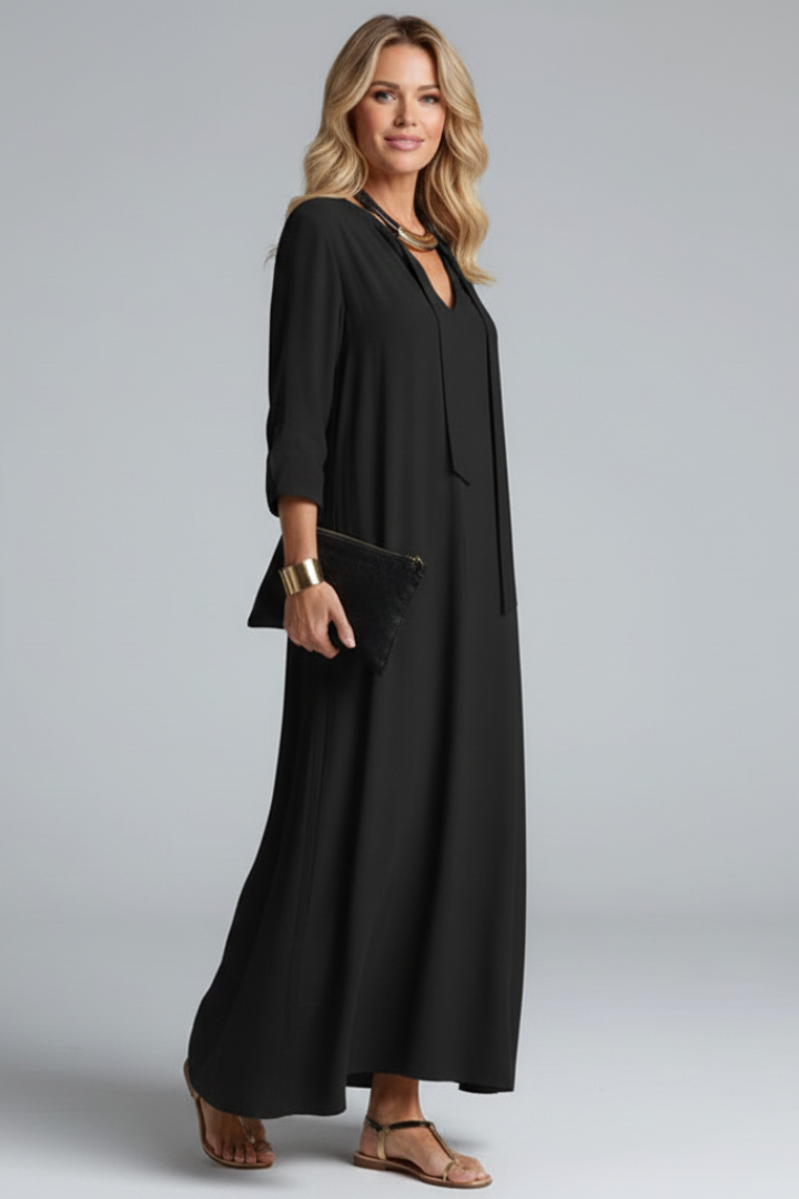 Women's V-neck ankle-length dress with long sleeves. Feminine and chic for casual or formal wear.