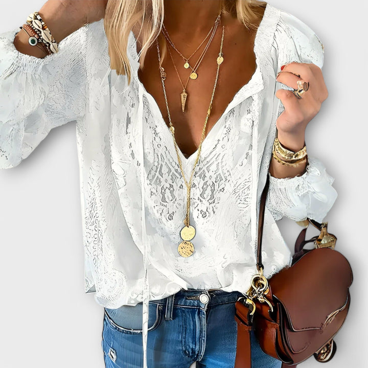 Elegant women's V-neck long sleeve lace blouse for versatile styling. Perfect for office or date night.