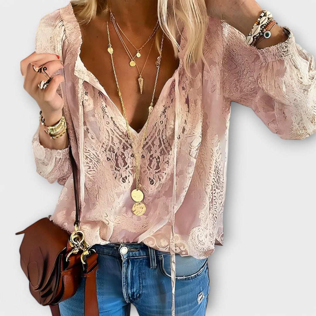 Romantic women's V-neck long sleeve blouse featuring intricate lace detailing, great for evening or day wear.