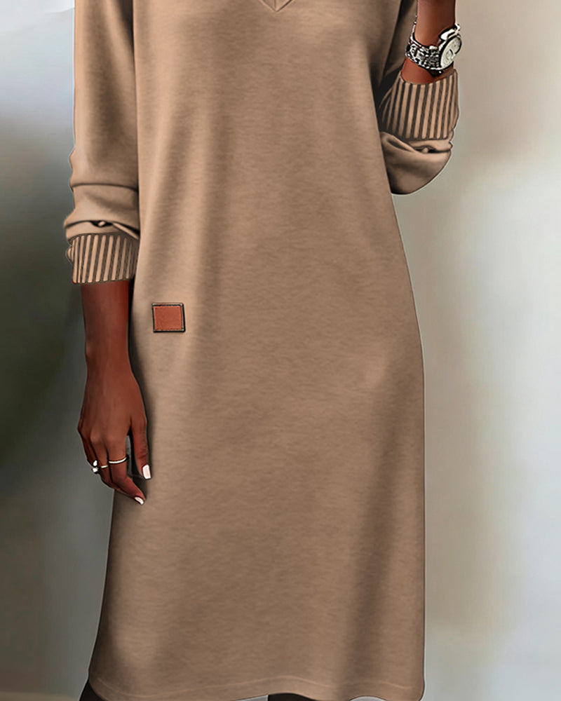 Full-length view of an elegant women's V-neck long sleeve midi dress, ideal for sophisticated office workwear.