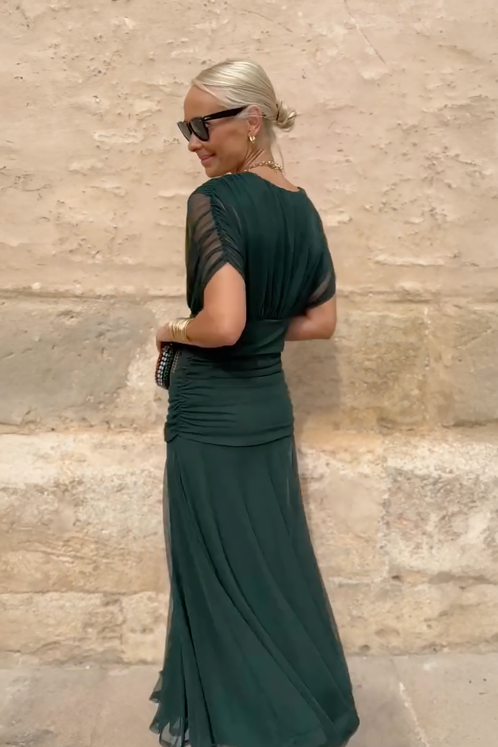 Women's elegant V-neck maxi dress with ruched waist, formal wedding guest attire.