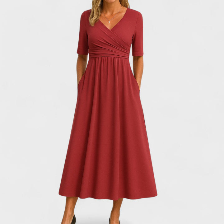 Elegant women's summer midi dress with a flattering V-neck. Perfect party clothing.