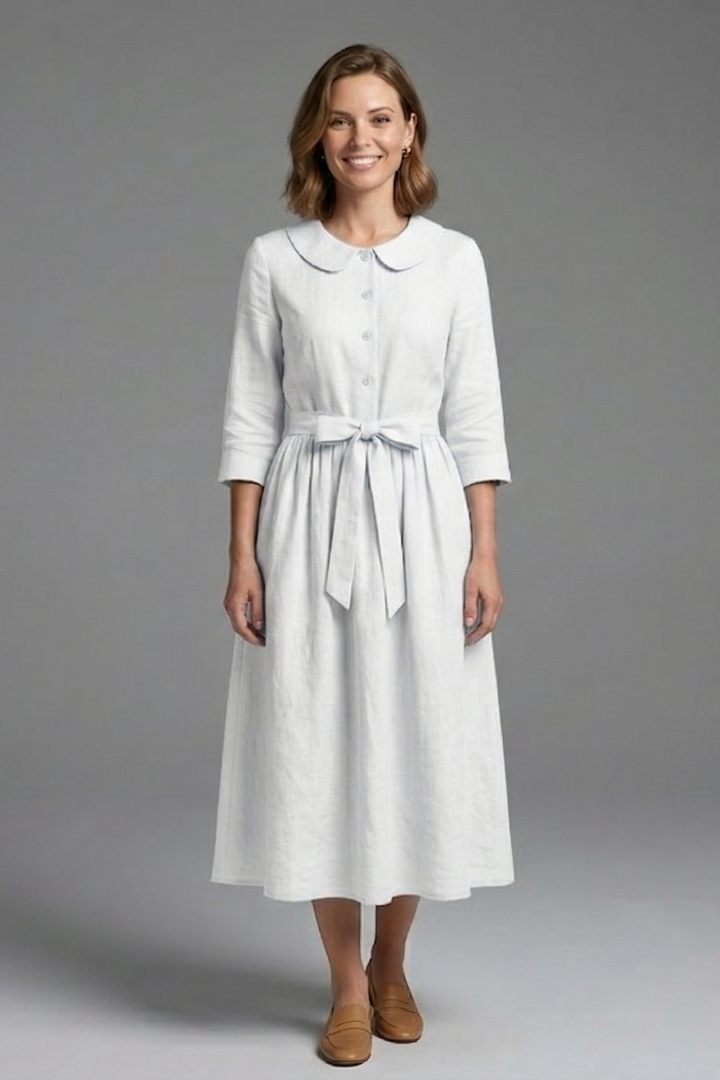 Sleeveless V-neck midi dress for women, featuring an elegant waist tie; ideal for formal events.