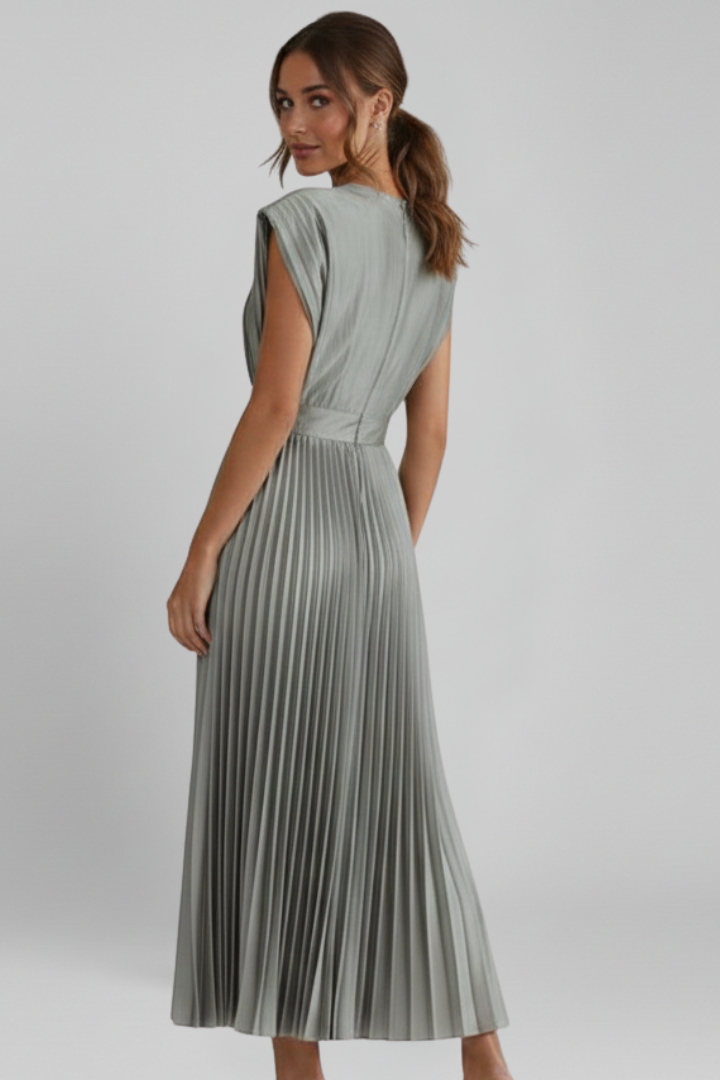 Luxurious fabric of a women's elegant V-neck pleated midi dress, designed for comfort and style.