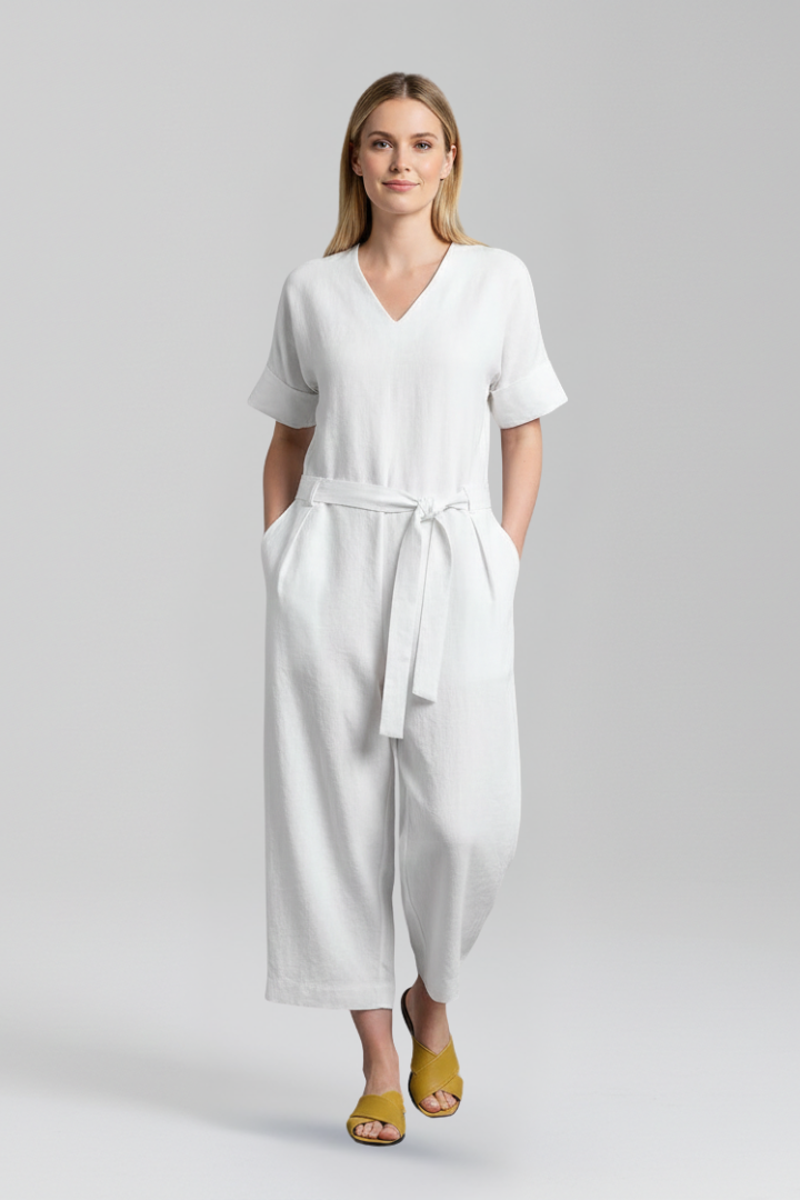 Chic women's jumpsuit with a V-neck, wide legs, and a stylish waist tie, perfect for versatile outfits.