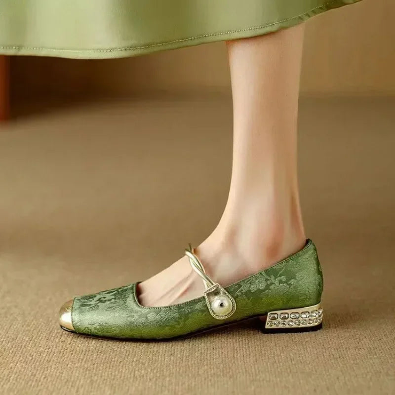 Comfortable women's orthopedic flats featuring elegant pearl details and a metallic shine.