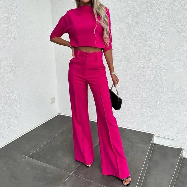High-waisted tailored trousers paired with a chic cropped top, forming a fashionable two-piece set.