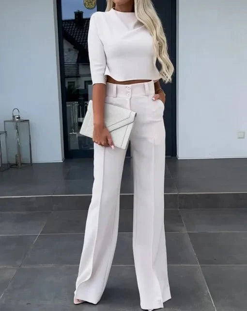 Full-body view of a women's elegant matching set, showcasing the cropped top and stylish trousers.