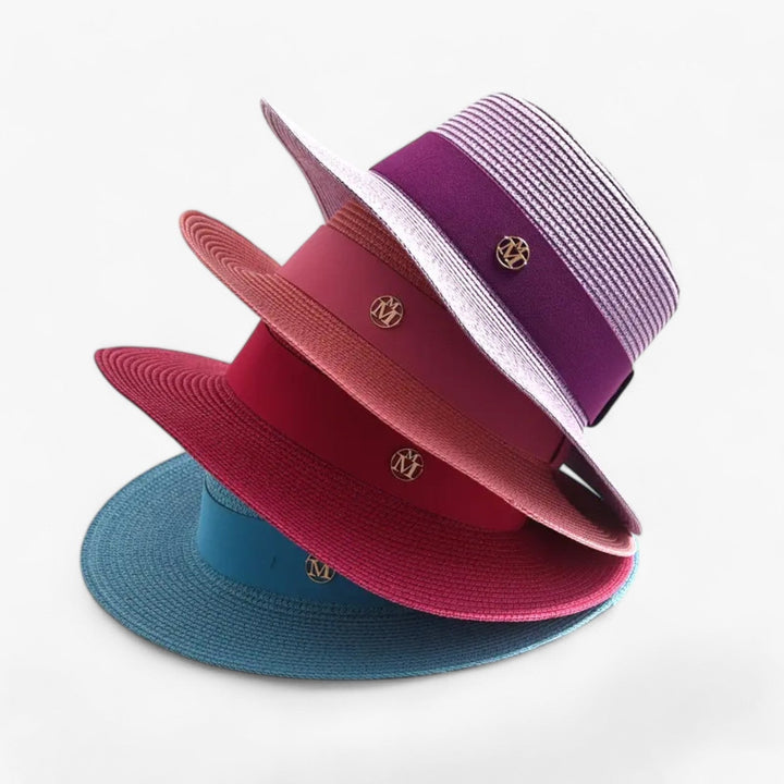 Elegant women's wide brim straw sun hat, perfect for UV protection & summer fashion.