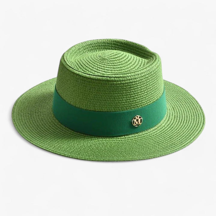 Stylish wide brim straw beach hat for women, offering excellent sun protection on sunny days.
