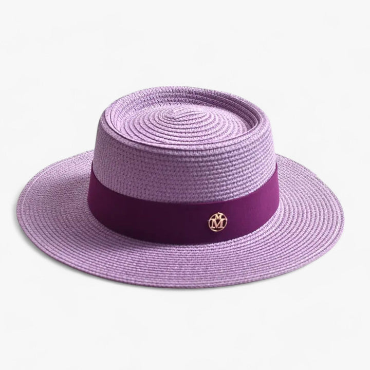 Women's elegant straw summer hat, a fashionable accessory with a wide brim for sun safety.