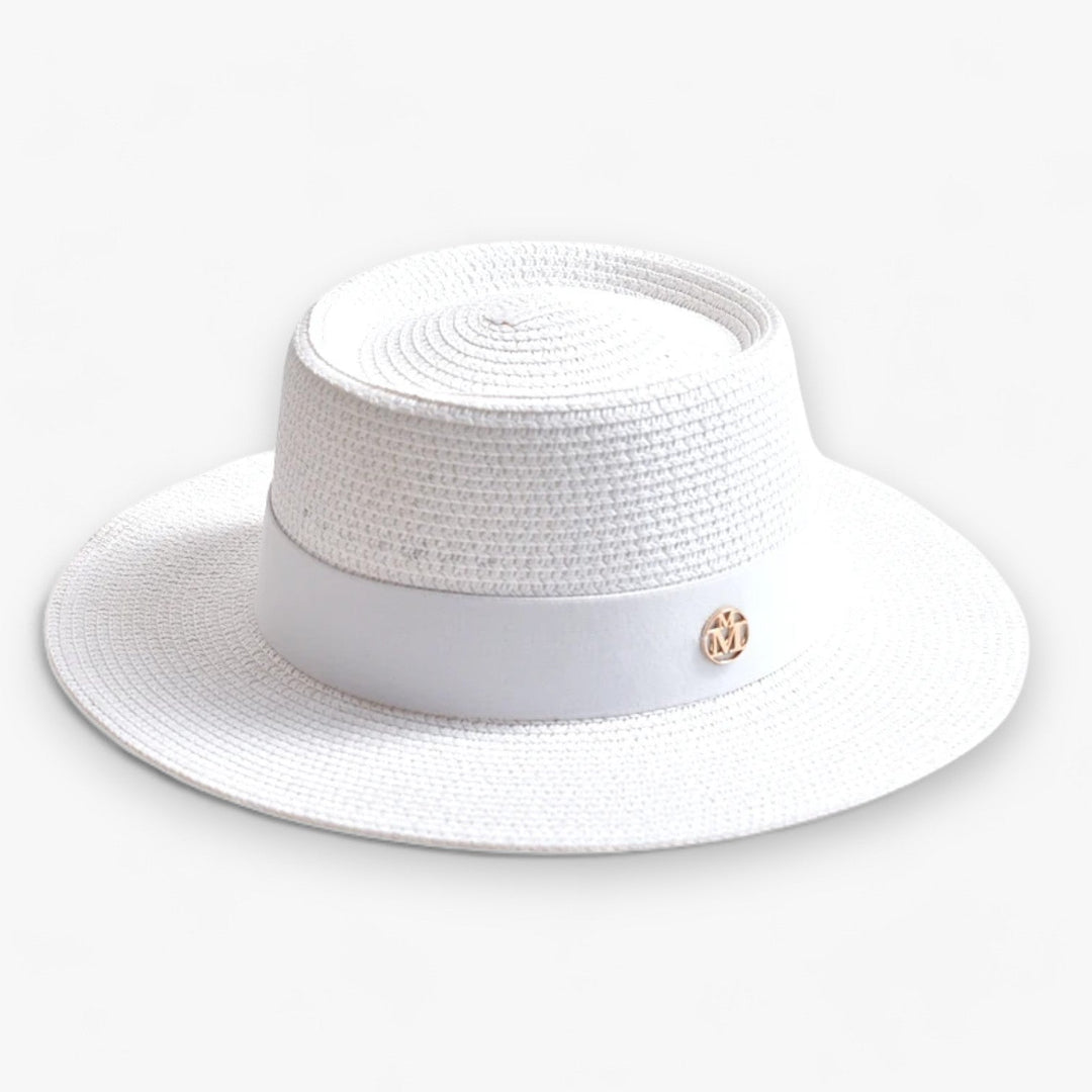 Beautiful women's wide brim beach hat, made of straw for stylish sun protection.