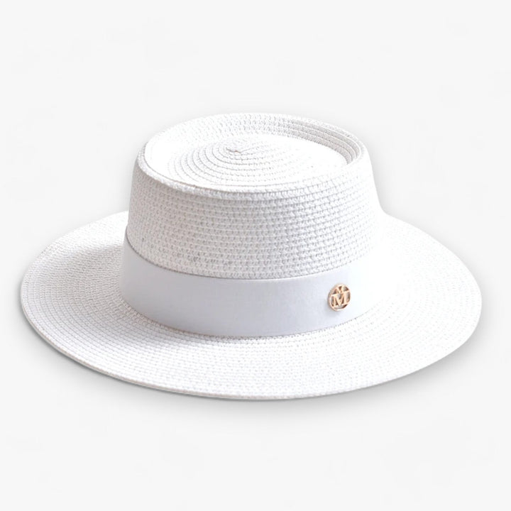 Beautiful women's wide brim beach hat, made of straw for stylish sun protection.