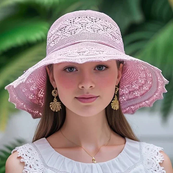 Elegant women's wide-brim sun hat, perfect for stylish summer beach fashion & UV protection.