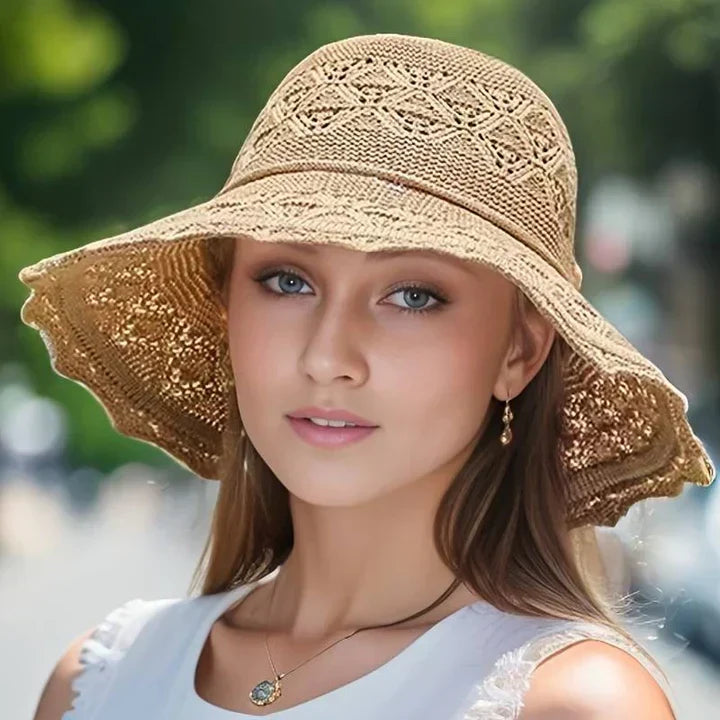 Stylish wide-brim women's sun hat, designed to be foldable for easy packing & beach trips.