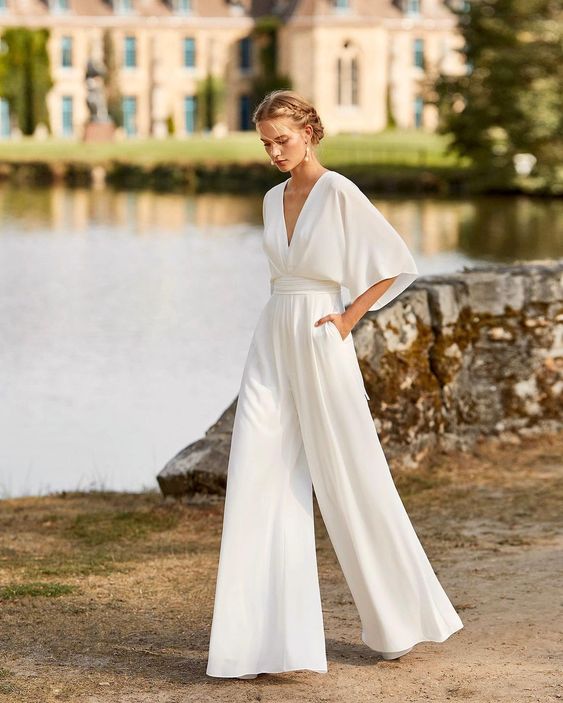 Elegant women's wide leg jumpsuit for evening events. Formal, sophisticated party outfit with button front detail.