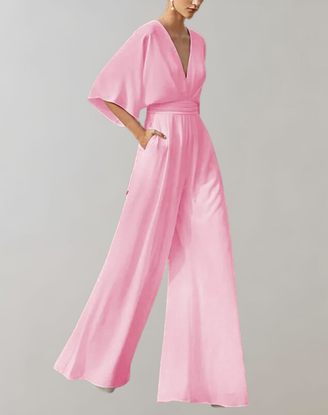 Side profile of a chic women's wide leg jumpsuit. Perfect formal evening wear or wedding guest attire.