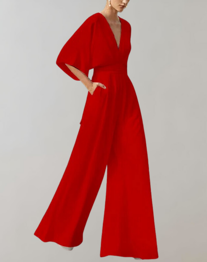 Close-up of button front detail on women's elegant wide leg jumpsuit. Chic formal evening wear design.