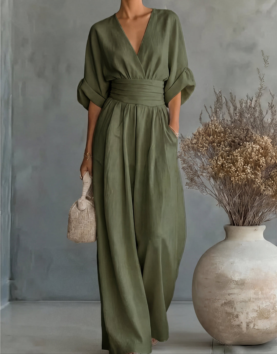 Elegant wide-leg jumpsuit for women, perfect occasion wear with a flattering wrap front design.
