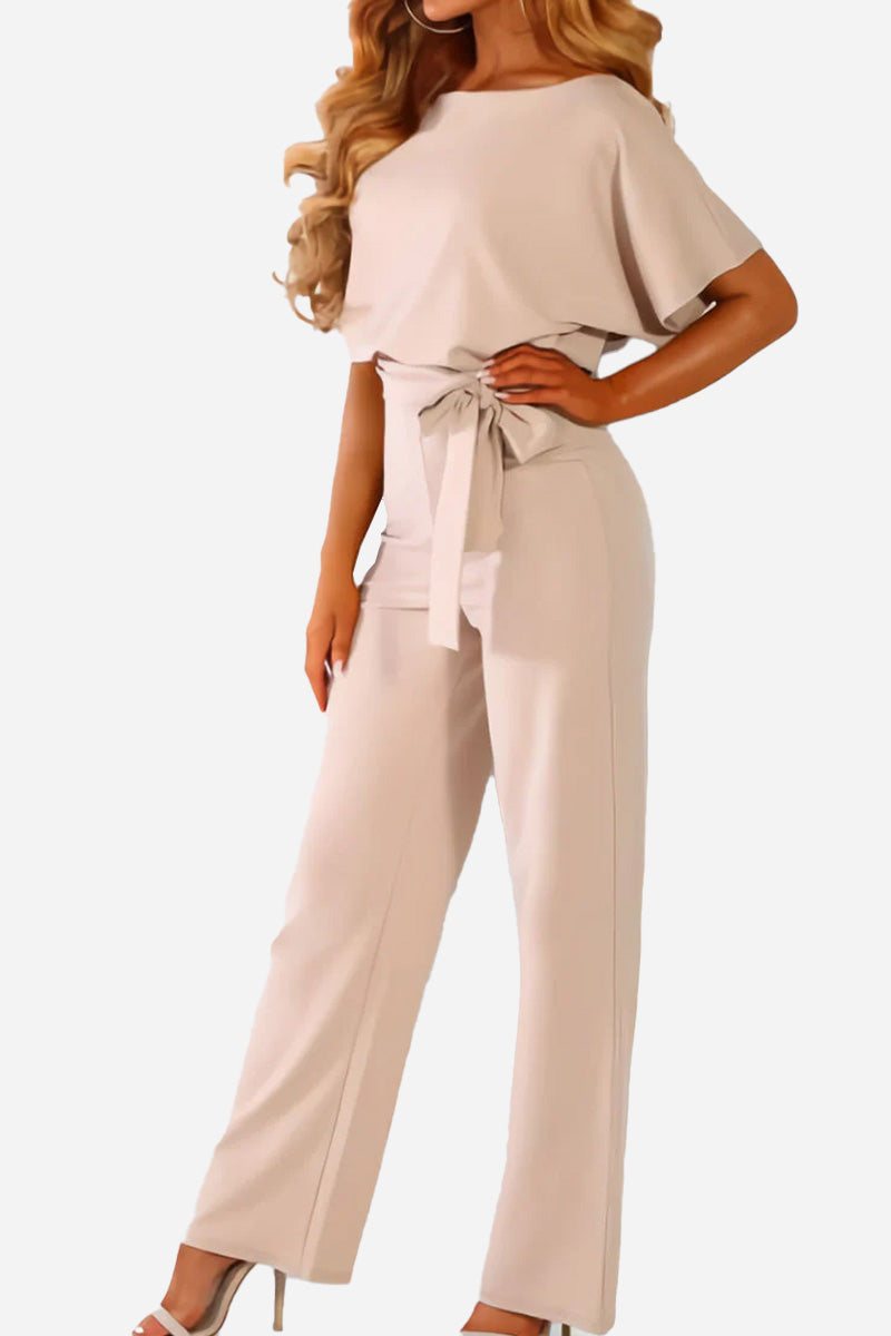 Stylish and comfortable women's wide-leg jumpsuit. Features batwing sleeves, belted waist, and relaxed fit.