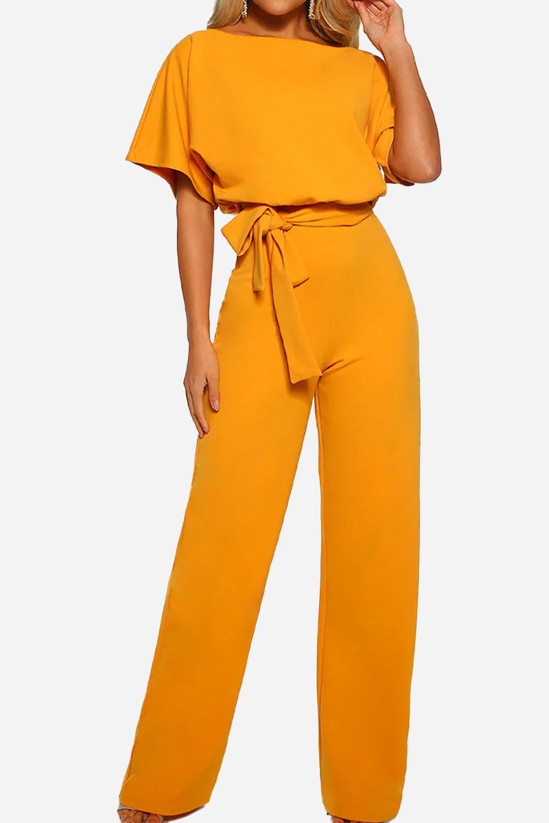 Chic women's elegant wide-leg jumpsuit with batwing sleeves. Belted design offers versatile day-to-night fashion.