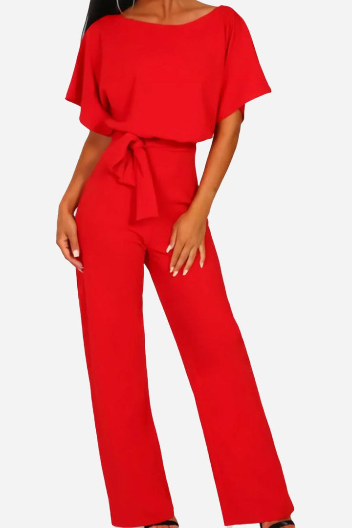 Fashionable women's wide-leg jumpsuit with flowy batwing sleeves & stylish belt. Offers a relaxed, elegant fit.