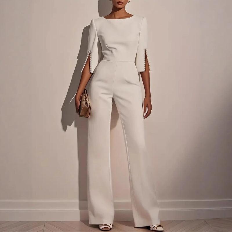 Elegant women's wide leg jumpsuit with chic pearl detail sleeves, perfect for sophisticated party or brunch wear.