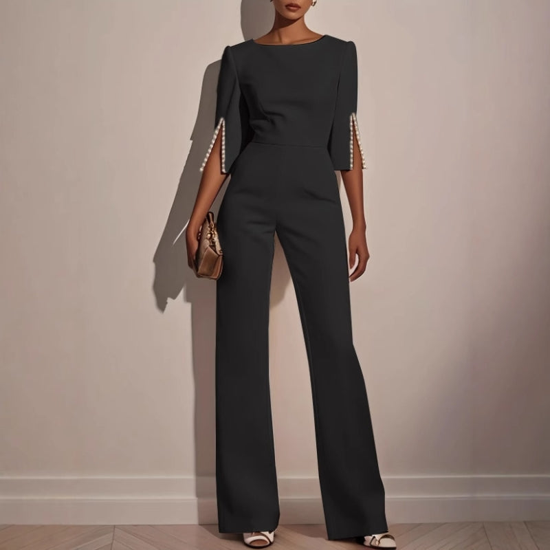 Sophisticated wide leg jumpsuit for women, showcasing unique pearl detail on sleeves, ideal for casual chic outfits.