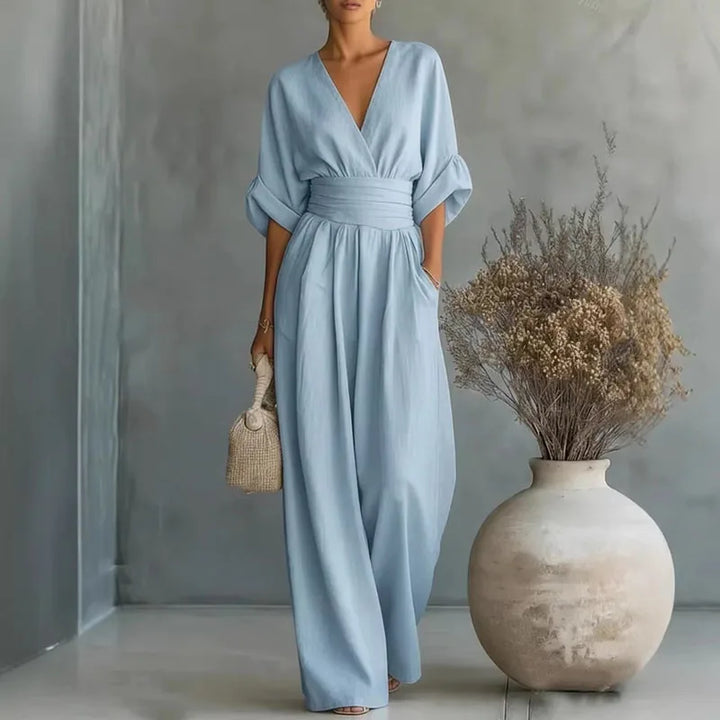 Comfortable wide leg jumpsuit for women, featuring a chic cinched waist and contemporary elegant fashion.