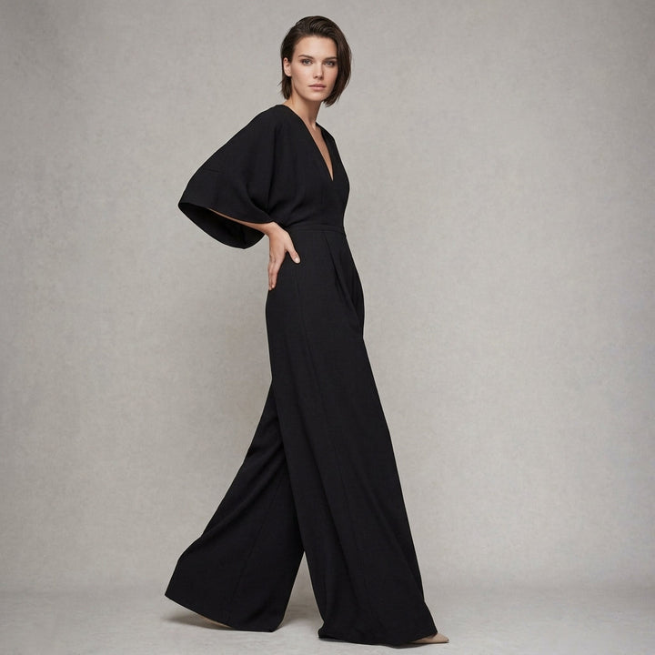 Elegant women's wide-leg jumpsuit with flowing sleeves and a V-neck, perfect for chic versatile fashion.