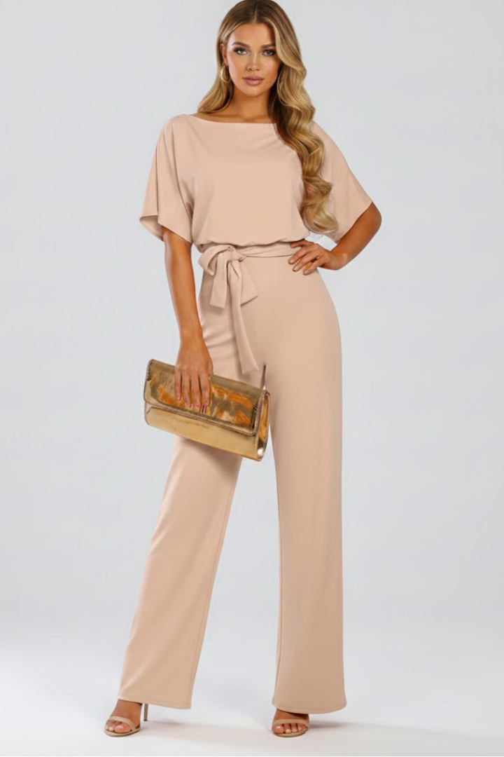 Chic women's wide-leg jumpsuit, comfortable & versatile, featuring a stylish tie waist and round neck.