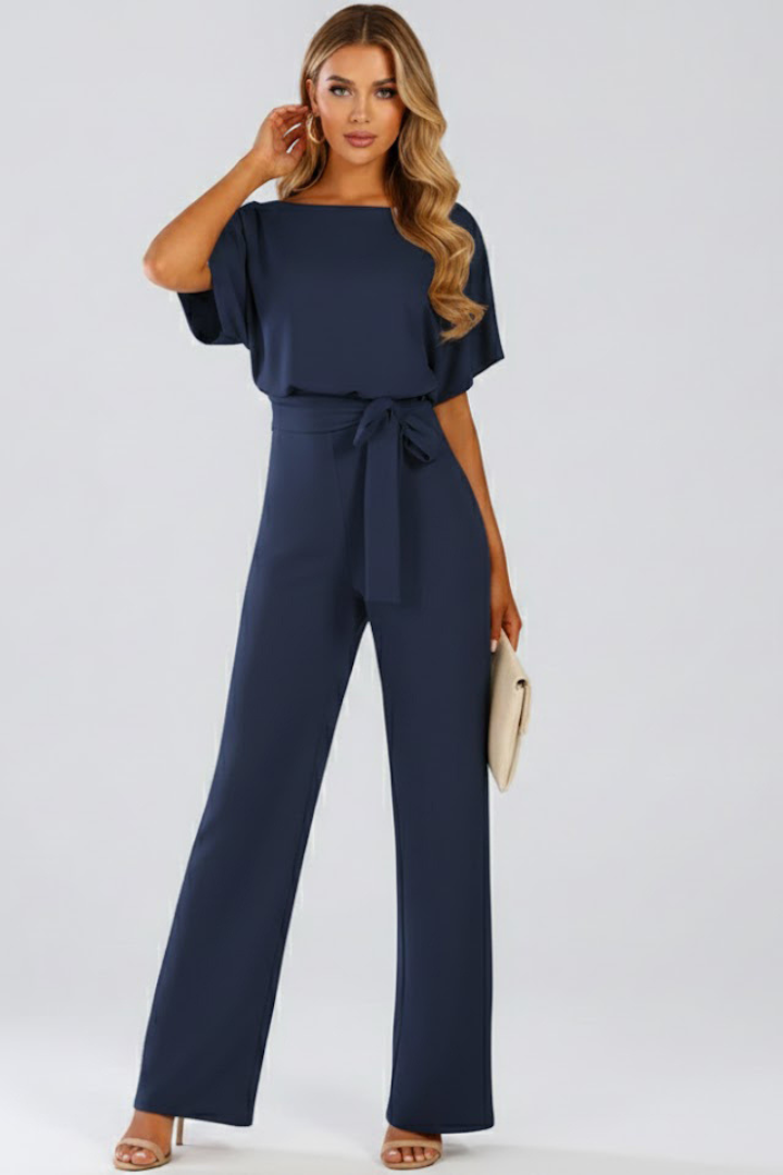 Elegant women's wide-leg jumpsuit with a sophisticated tie waist, short sleeves, and comfortable full-length design.