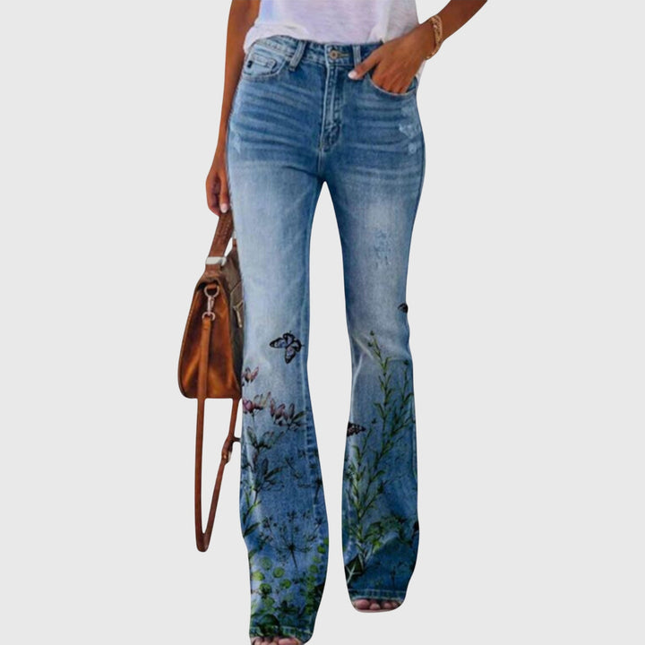 Close-up of women's flowy floral wide-leg pants, showing button detail and comfortable fabric.