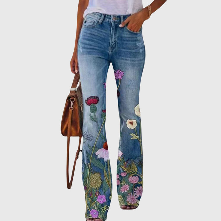 Fashionable woman wearing elegant floral wide-leg pants, styled for a chic, comfortable look.