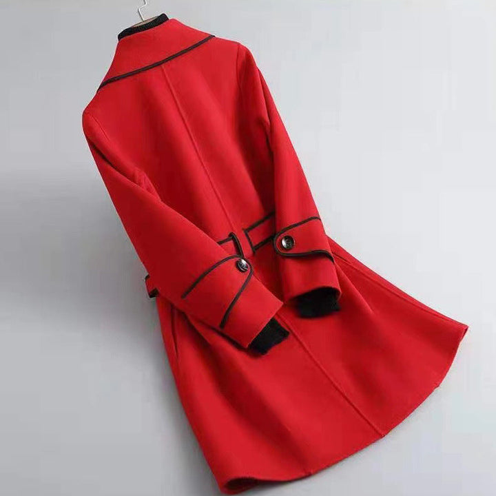 Luxury women's outerwear: a warm wool-blend longline coat with belt and sophisticated piping
