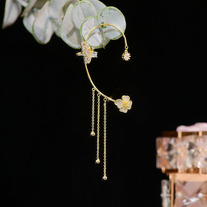 Women's elegant dangle earrings, showcasing intricate butterfly design and brilliant zircon accents.