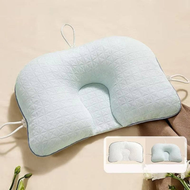 Ergonomic baby pillow for flat head prevention. Soft, breathable infant support for newborns & safe sleep.