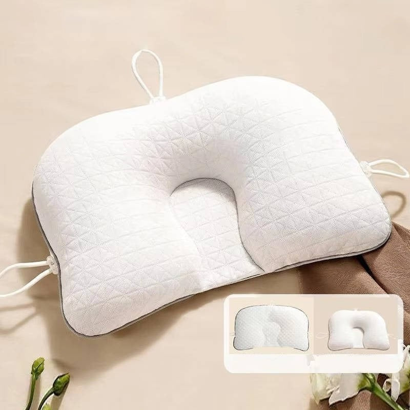Newborn ergonomic pillow for safe sleep, preventing flat head syndrome. Essential infant support & comfort.