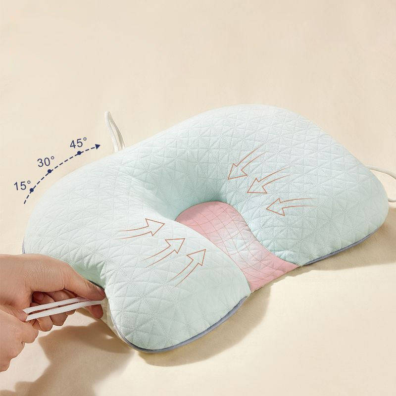 Soft crib pillow with head shaping design for babies. Provides ergonomic support & flat head prevention for infants.