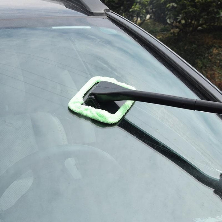 Close-up of ergonomic car windshield cleaner handle designed for comfortable and effective auto care.