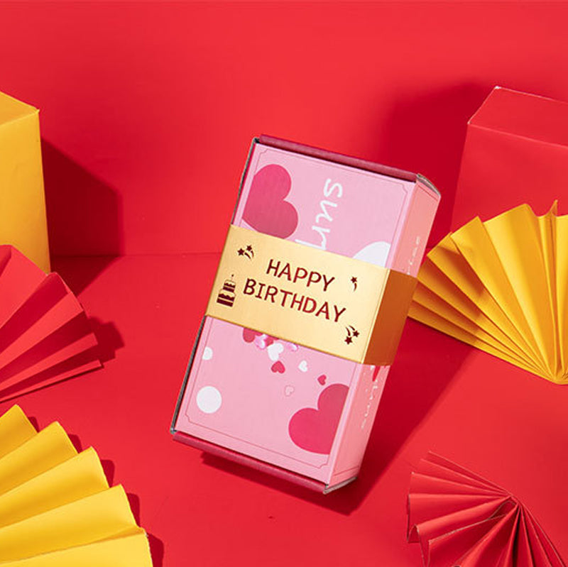 A hand reaching out to open the Exploding Surprise Gift Box, anticipation for the bouncing cubes.